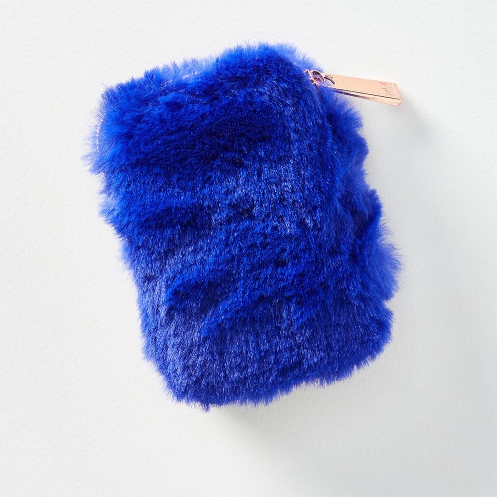 Anthropologie earbud and AirPod holder. Sold out.